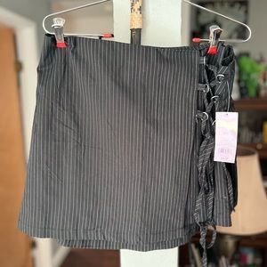 New with tags black with whit pen stripe and partial tie one side black skirt